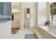 Well-lit bathroom with soaking tub, walk-in shower, and double vanity sinks at 4612 35Th E Ave, Palmetto, FL 34221