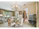 Formal dining room with neutral walls and seating for four with view to the living room at 4612 35Th E Ave, Palmetto, FL 34221