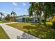 Well-maintained single-story home with lush lawn, mature trees and an attached garage at 4612 35Th E Ave, Palmetto, FL 34221