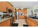 Well-lit kitchen with stainless steel appliances and granite countertops showcasing ample cabinet space at 4612 35Th E Ave, Palmetto, FL 34221