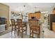 Kitchen with breakfast bar featuring granite countertops and wooden stools at 4612 35Th E Ave, Palmetto, FL 34221