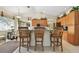 Bright kitchen with breakfast bar featuring granite countertops and wooden stools at 4612 35Th E Ave, Palmetto, FL 34221