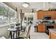 Well-lit kitchen nook with a view of the patio through sliding glass doors and modern stainless steel appliances at 4612 35Th E Ave, Palmetto, FL 34221