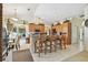 Open-concept kitchen with breakfast bar, granite countertops and dining area at 4612 35Th E Ave, Palmetto, FL 34221