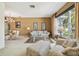 Cozy living room with a glass coffee table, comfortable seating, and adjacent dining area bathed in natural light at 4612 35Th E Ave, Palmetto, FL 34221