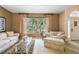 Comfortable living room with a large window, neutral tones, and plush seating perfect for relaxation at 4612 35Th E Ave, Palmetto, FL 34221