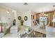 Inviting living room featuring neutral colors, elegant furniture, and an adjacent dining area with natural light at 4612 35Th E Ave, Palmetto, FL 34221