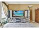 Comfortable living room area features a modern entertainment center and natural light at 4612 35Th E Ave, Palmetto, FL 34221