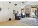 Living room features a fireplace and cozy seating with view to the kitchen at 4612 35Th E Ave, Palmetto, FL 34221