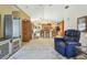Open living space with breakfast bar and modern kitchen with stainless steel appliances at 4612 35Th E Ave, Palmetto, FL 34221