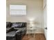 Small office features seating, a table and lamp, and natural light from the window at 4612 35Th E Ave, Palmetto, FL 34221