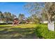 Community playground with slides, swings, and greenery, located at Sugar Mill Lakes at 4612 35Th E Ave, Palmetto, FL 34221