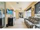 Bright sunroom featuring tile floor, ceiling fan, comfortable seating, and sliding glass door at 4612 35Th E Ave, Palmetto, FL 34221