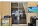 The sunroom features tile floors and sliding glass doors that provide ample light at 4612 35Th E Ave, Palmetto, FL 34221