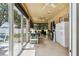 Spacious sunroom featuring tile flooring, comfortable seating, and large glass doors overlooking the backyard at 4612 35Th E Ave, Palmetto, FL 34221