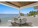 Waterfront balcony featuring outdoor seating and views of the bay at 5110 W Longfellow Ave, Tampa, FL 33629