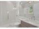 Bright, spacious bathroom featuring glass shower, marble countertop, and chrome fixtures at 5110 W Longfellow Ave, Tampa, FL 33629