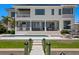 Luxury home featuring an outdoor living area with a pool, landscaping, and modern architectural details at 5110 W Longfellow Ave, Tampa, FL 33629