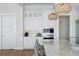Bright kitchen with white cabinets, marble countertops, and stainless steel appliances at 5110 W Longfellow Ave, Tampa, FL 33629