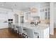 Gourmet kitchen with a large island, stainless steel appliances, custom cabinets, and an open layout at 5110 W Longfellow Ave, Tampa, FL 33629