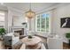 Bright living room with stone fireplace, hardwood floors, and a large window with beautiful view at 5110 W Longfellow Ave, Tampa, FL 33629