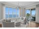 Bright living room featuring comfortable seating, a large picture window, and water views at 5110 W Longfellow Ave, Tampa, FL 33629