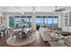 Spacious living room with views of the water, hardwood floors, comfortable seating, and an elegant round table at 5110 W Longfellow Ave, Tampa, FL 33629