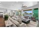 Beautiful living room with water views, a dining area, comfortable seating, and seamless indoor-outdoor living at 5110 W Longfellow Ave, Tampa, FL 33629