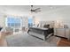 Spacious main bedroom featuring water views, ample seating, and neutral color palette at 5110 W Longfellow Ave, Tampa, FL 33629