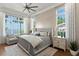 Cozy main bedroom with water views, hardwood floors, and large windows at 5110 W Longfellow Ave, Tampa, FL 33629