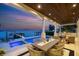 Elegant waterfront outdoor dining area with serene views, perfect for al fresco meals and relaxation by the pool at 5110 W Longfellow Ave, Tampa, FL 33629