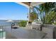Outdoor kitchen featuring stone counter and stainless steel gas grill with waterfront views at 5110 W Longfellow Ave, Tampa, FL 33629