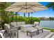 Charming outdoor lounge area with comfortable seating and verdant greenery, offering a serene retreat at 5110 W Longfellow Ave, Tampa, FL 33629
