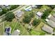 The lot features mature trees, and detached structures with ample space between neighbors at 5250 Brody Blvd, Wimauma, FL 33598