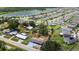 The house is situated near a serene lake in a well-established neighborhood with large lots at 5250 Brody Blvd, Wimauma, FL 33598