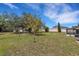 Spacious backyard surrounded by mature trees, creating a private oasis at 5250 Brody Blvd, Wimauma, FL 33598