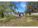 Backyard featuring two storage sheds, providing ample space for outdoor equipment and tools at 5250 Brody Blvd, Wimauma, FL 33598