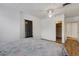 Comfortable bedroom with ceiling fan and closet/hallway access at 5250 Brody Blvd, Wimauma, FL 33598