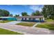 Inviting home with a well-maintained front yard, an attached garage, and a quaint, classic exterior design at 5250 Brody Blvd, Wimauma, FL 33598