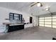 Spacious garage features built-in shelving and workspace, providing ample storage and utility at 5250 Brody Blvd, Wimauma, FL 33598