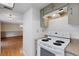 Clean kitchen features a white range, tiled backsplash, and laminate countertops at 5250 Brody Blvd, Wimauma, FL 33598