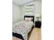 Cozy bedroom with hardwood floors, natural light, and fresh paint at 5654 12Th St, Zephyrhills, FL 33542