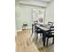 Dining room with hardwood floors and view into living room at 5654 12Th St, Zephyrhills, FL 33542