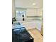 Bright kitchen with white cabinets, granite countertops, and stainless steel appliances at 5654 12Th St, Zephyrhills, FL 33542