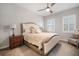 Serene main bedroom with neutral colors, plush carpet, plantation shutters, and tasteful decor at 610 Winterside Dr, Apollo Beach, FL 33572