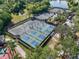 Aerial view of community pickleball courts surrounded by trees and landscaping in a park-like setting at 610 Winterside Dr, Apollo Beach, FL 33572