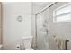Neutral bathroom features glass enclosed shower, neutral tile and towel bar at 708 Rutgers Pl, Sun City Center, FL 33573