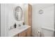 Bright bathroom with a spacious sink, a cabinet and a mirror at 708 Rutgers Pl, Sun City Center, FL 33573