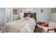 Cozy bedroom with soft blue walls, comfortable queen bed and bright natural light at 708 Rutgers Pl, Sun City Center, FL 33573