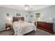 Inviting bedroom with soft blue walls, comfortable bed, dresser and bright natural light at 708 Rutgers Pl, Sun City Center, FL 33573